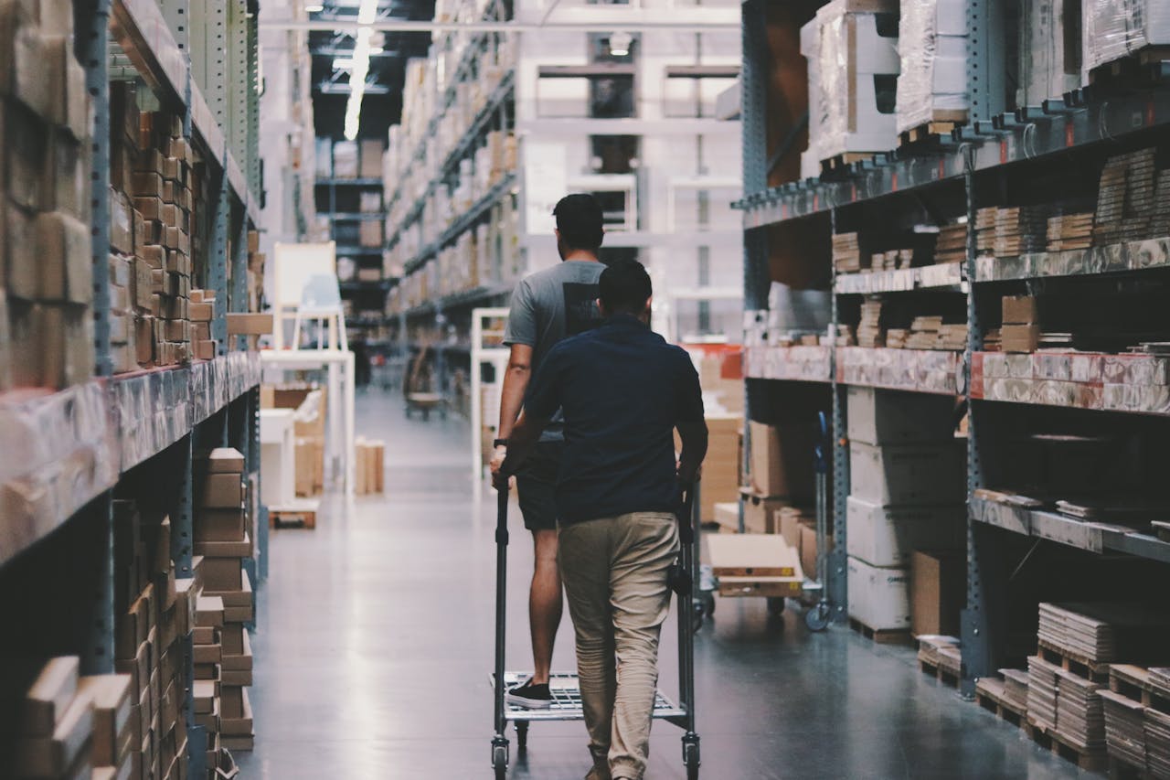 Two people walking through a hardware store