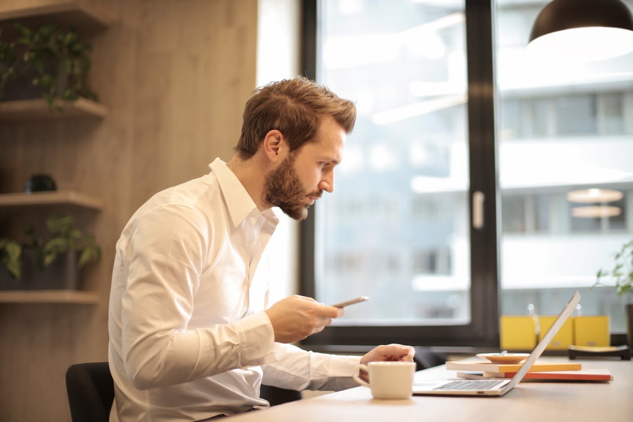 Man focusing while working on laptop